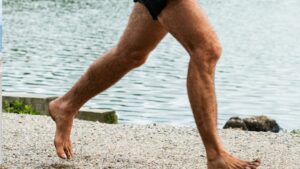 Barefoot_Running_1920x1080 Close up of legs of man running barefoot