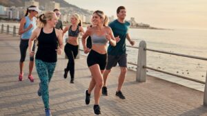 Running Group 1920×1080 Group of Runners running along seaside boulevard